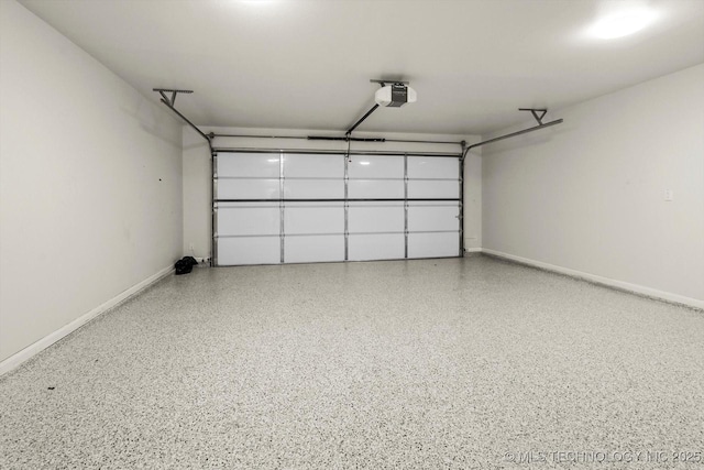 13236 E 4th Pl, Tulsa, OK 74108 - garage featuring a garage door opener and baseboards