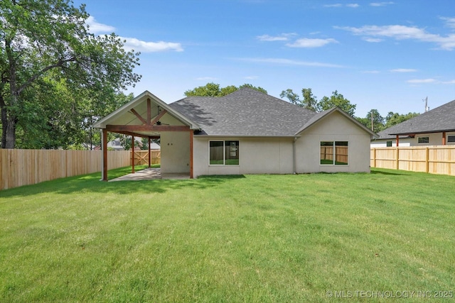 13236 E 4th Pl, Tulsa, OK 74108 - rear view of property featuring a patio, a fenced backyard, a shingled roof, and stucco siding