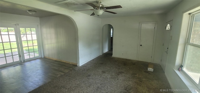 3315 S 116th E Pl, Tulsa, OK 74146 - unfurnished room with arched walkways, ceiling fan, and carpet floors
