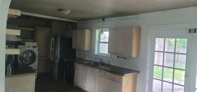 3315 S 116th E Pl, Tulsa, OK 74146 - kitchen with washer / clothes dryer, decorative backsplash, dishwashing machine, dark wood-type flooring, and freestanding refrigerator