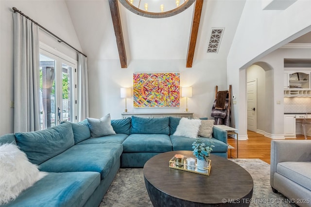 1536 E 35th Pl, Tulsa, OK 74105 - living room featuring arched walkways and wood finished floors