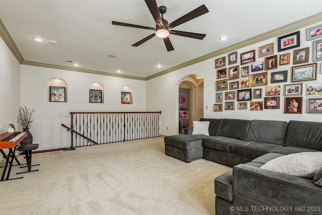 1536 E 35th Pl, Tulsa, OK 74105 - carpeted living room with a ceiling fan, arched walkways, ornamental molding, and recessed lighting
