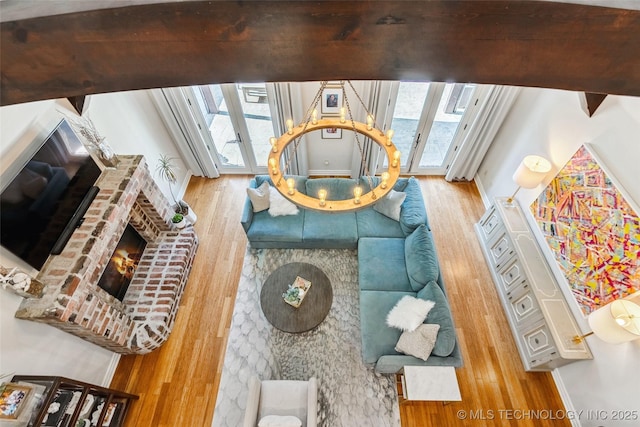 1536 E 35th Pl, Tulsa, OK 74105 - living area with wood finished floors, plenty of natural light, and a brick fireplace