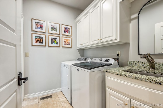 1536 E 35th Pl, Tulsa, OK 74105 - laundry area with washer and dryer and cabinet space