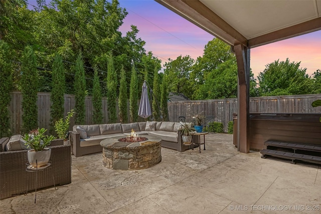 1536 E 35th Pl, Tulsa, OK 74105 - fenced backyard with an outdoor living space with a fire pit and a patio area