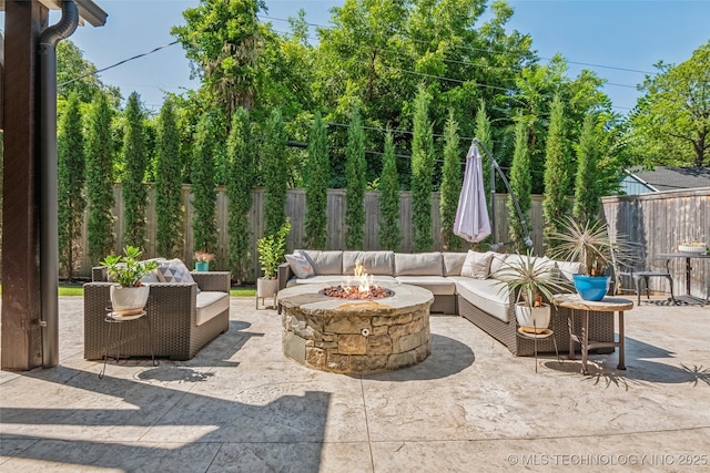 1536 E 35th Pl, Tulsa, OK 74105 - fenced backyard with an outdoor living space with a fire pit and a patio