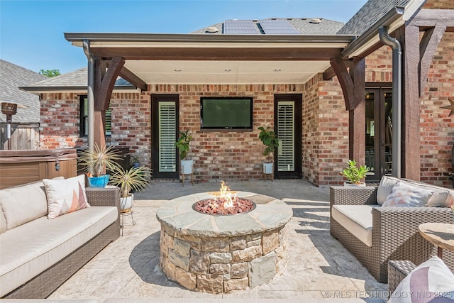 1536 E 35th Pl, Tulsa, OK 74105 - view of patio / terrace featuring an outdoor living space with a fire pit, a hot tub, and french doors