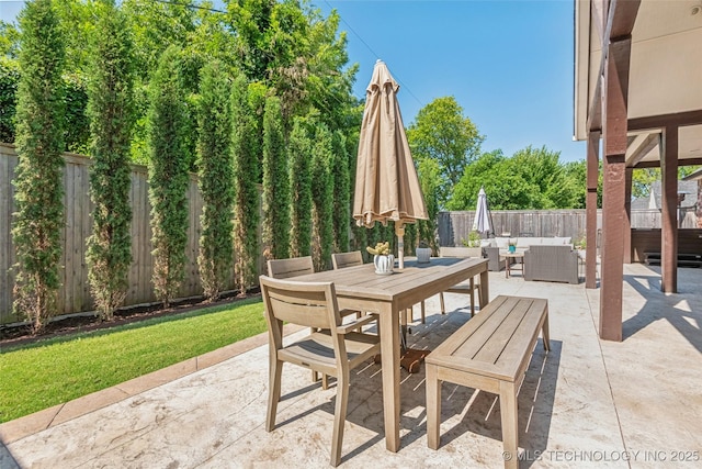 1536 E 35th Pl, Tulsa, OK 74105 - fenced backyard with an outdoor hangout area, a patio area, and outdoor dining area