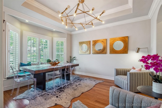 1536 E 35th Pl, Tulsa, OK 74105 - dining space with a raised ceiling, wood finished floors, crown molding, and a chandelier