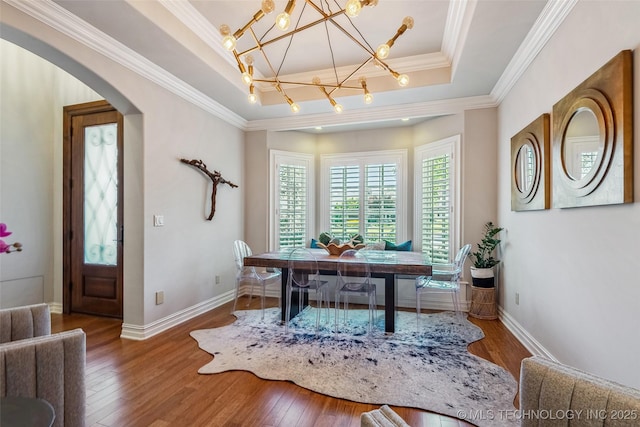 1536 E 35th Pl, Tulsa, OK 74105 - home office with a raised ceiling, a chandelier, hardwood / wood-style floors, crown molding, and arched walkways