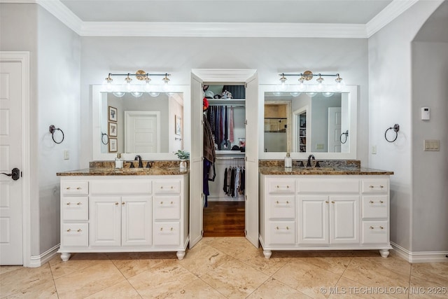 1536 E 35th Pl, Tulsa, OK 74105 - full bathroom featuring two vanities, crown molding, and a walk in closet