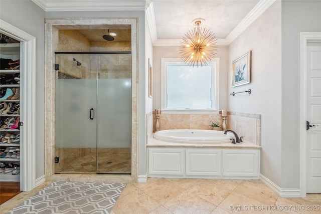 1536 E 35th Pl, Tulsa, OK 74105 - full bath featuring a garden tub, a stall shower, a chandelier, a spacious closet, and ornamental molding