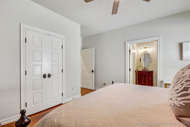 1536 E 35th Pl, Tulsa, OK 74105 - bedroom featuring wood finished floors, a ceiling fan, and connected bathroom