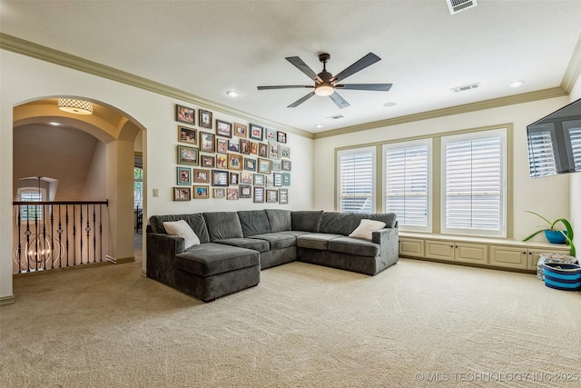 1536 E 35th Pl, Tulsa, OK 74105 - carpeted living area featuring a ceiling fan, ornamental molding, arched walkways, and recessed lighting