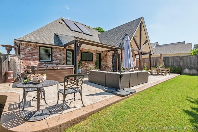 1536 E 35th Pl, Tulsa, OK 74105 - rear view of house with a hot tub, roof with shingles, a patio area, outdoor lounge area, and a fenced backyard