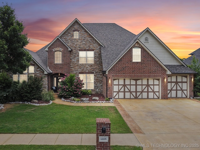 12225 S Glen Ct, Jenks, OK 74037 - view of front of home featuring driveway, a front yard, stone siding, a shingled roof, and an attached garage