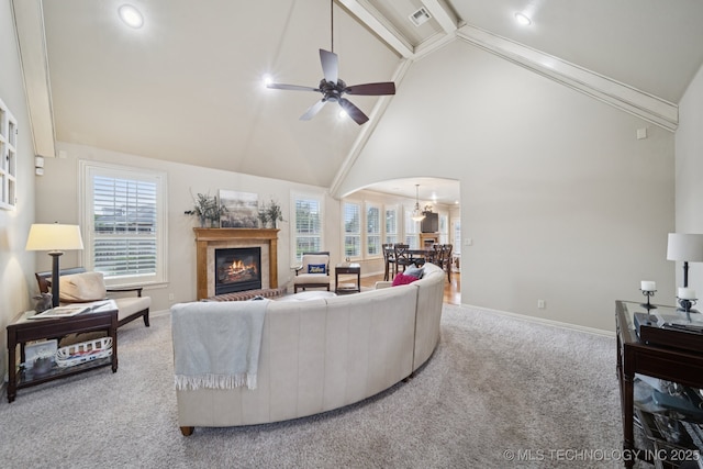 12225 S Glen Ct, Jenks, OK 74037 - living area with carpet floors, a glass covered fireplace, high vaulted ceiling, a ceiling fan, and beamed ceiling