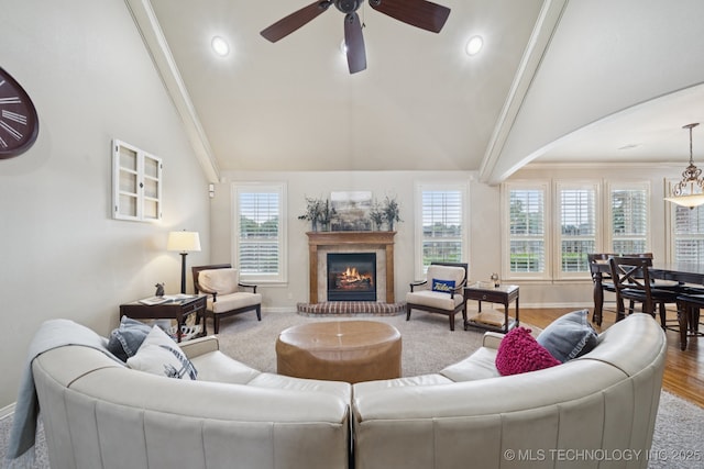 12225 S Glen Ct, Jenks, OK 74037 - living room featuring high vaulted ceiling, ceiling fan, healthy amount of natural light, a glass covered fireplace, and recessed lighting