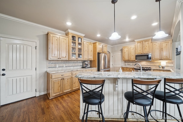 12225 S Glen Ct, Jenks, OK 74037 - kitchen with stainless steel appliances, a breakfast bar area, glass insert cabinets, light brown cabinets, and ornamental molding