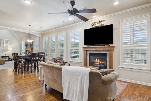 12225 S Glen Ct, Jenks, OK 74037 - living room featuring a glass covered fireplace, a ceiling fan, crown molding, wood finished floors, and recessed lighting