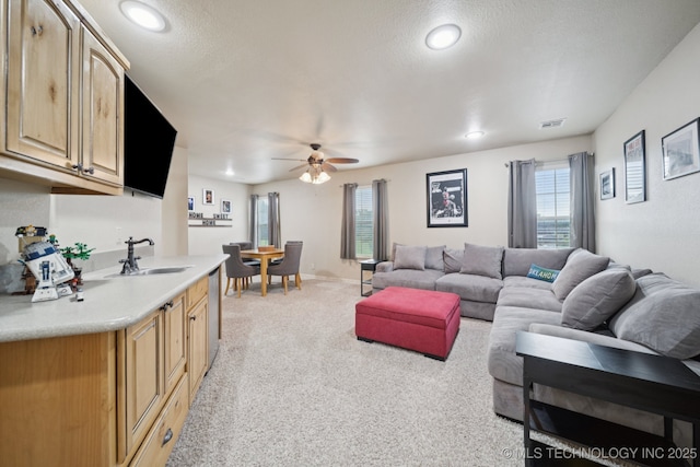 12225 S Glen Ct, Jenks, OK 74037 - living room featuring light colored carpet, a ceiling fan, and recessed lighting