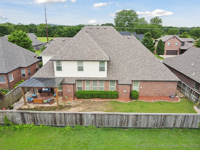12225 S Glen Ct, Jenks, OK 74037 - view of front of home featuring brick siding, a fenced backyard, roof with shingles, and a patio area