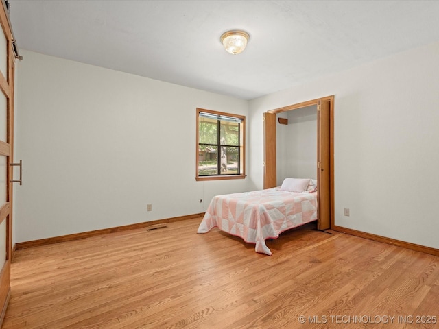 3321 Woodland Rd, Bartlesville, OK 74006 - bedroom featuring light wood-type flooring