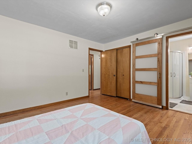 3321 Woodland Rd, Bartlesville, OK 74006 - unfurnished bedroom with wood finished floors and connected bathroom