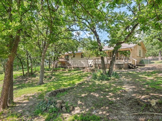 3321 Woodland Rd, Bartlesville, OK 74006 - view of yard featuring a deck and stairs
