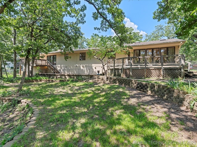 3321 Woodland Rd, Bartlesville, OK 74006 - view of grassy yard with a deck and stairs