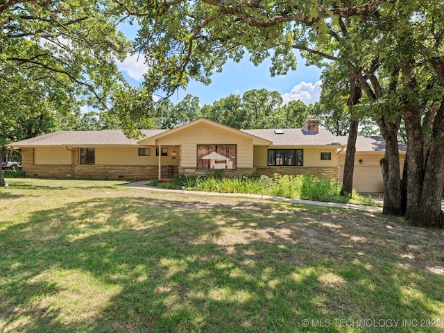 3321 Woodland Rd, Bartlesville, OK 74006 - ranch-style home with a chimney, stone siding, a front yard, an attached garage, and brick siding