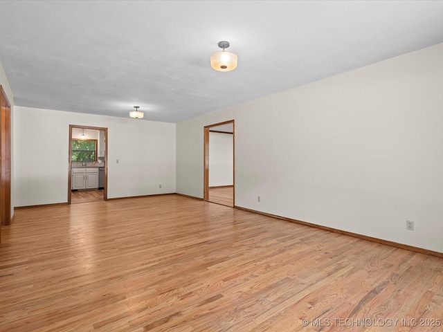 3321 Woodland Rd, Bartlesville, OK 74006 - empty room featuring light wood finished floors