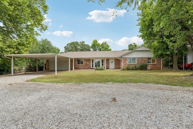 13201 W 86th St S, Sapulpa, OK 74066 - single story home featuring gravel driveway, an attached carport, a front yard, and brick siding