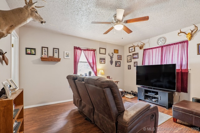 13201 W 86th St S, Sapulpa, OK 74066 - living room with ceiling fan, a textured ceiling, and wood finished floors