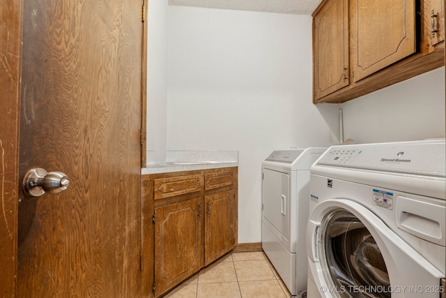 13201 W 86th St S, Sapulpa, OK 74066 - washroom featuring cabinet space, separate washer and dryer, and light tile patterned floors