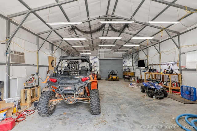 13201 W 86th St S, Sapulpa, OK 74066 - garage featuring a wall unit AC and a workshop area