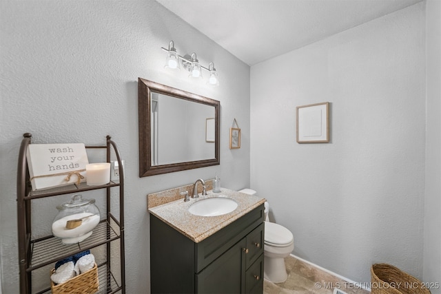 1377 S Wortman Ave, Claremore, OK 74017 - half bathroom featuring vanity and toilet