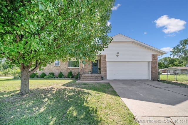 1377 S Wortman Ave, Claremore, OK 74017 - view of front of property with brick siding, an attached garage, and concrete driveway