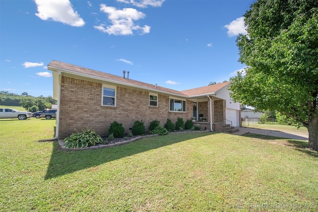 1377 S Wortman Ave, Claremore, OK 74017 - single story home featuring a garage, a front yard, brick siding, and concrete driveway