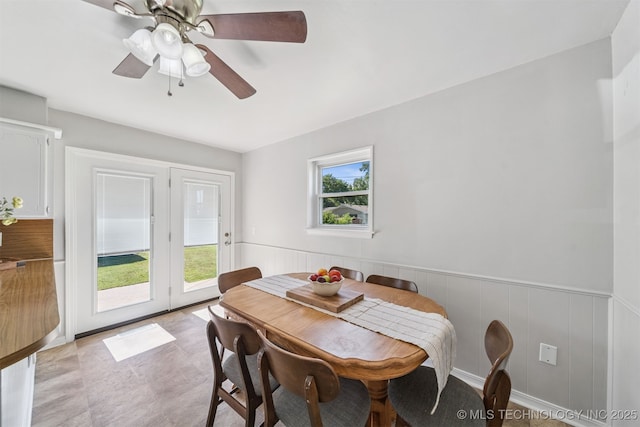 1377 S Wortman Ave, Claremore, OK 74017 - dining area with a wainscoted wall and a ceiling fan