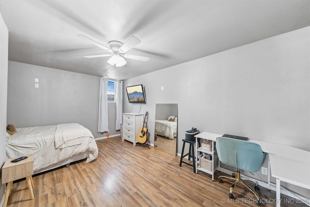 1377 S Wortman Ave, Claremore, OK 74017 - bedroom with wood finished floors and a ceiling fan