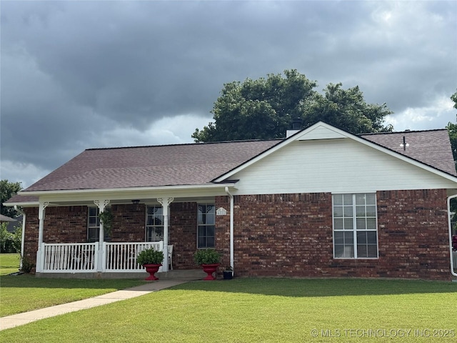 4001 Chaucer, Muskogee, OK 74403 - single story home with covered porch, brick siding, a front lawn, and roof with shingles