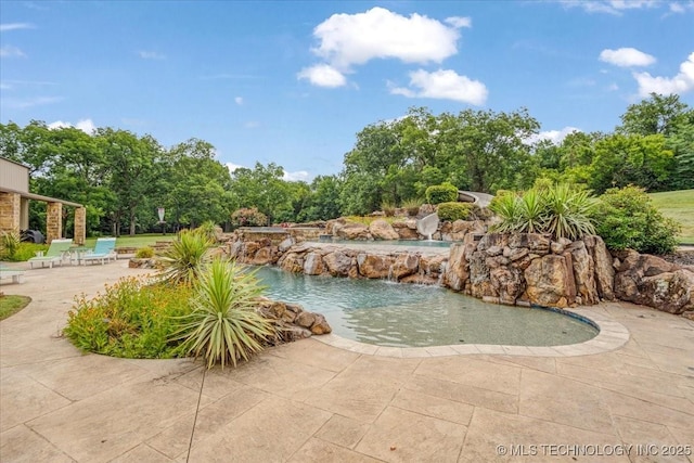 3892 Folsom Rd, Durant, OK 74701 - view of swimming pool featuring a patio area, a water slide, and view of scattered trees