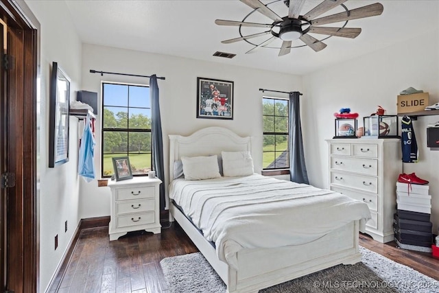 3892 Folsom Rd, Durant, OK 74701 - bedroom featuring dark wood finished floors and a ceiling fan