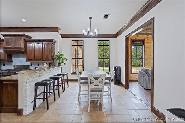 3892 Folsom Rd, Durant, OK 74701 - dining room with ornamental molding, a chandelier, and recessed lighting