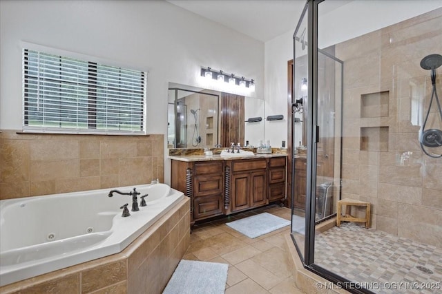 3892 Folsom Rd, Durant, OK 74701 - full bathroom with a stall shower, vanity, a jetted tub, and tile patterned floors