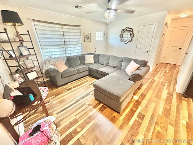 1105 NW 9th St, Stigler, OK 74462 - living area with light wood-style flooring and ceiling fan