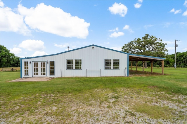 17652 S Hickory St, Sapulpa, OK 74066 - rear view of property featuring french doors, a lawn, and a carport