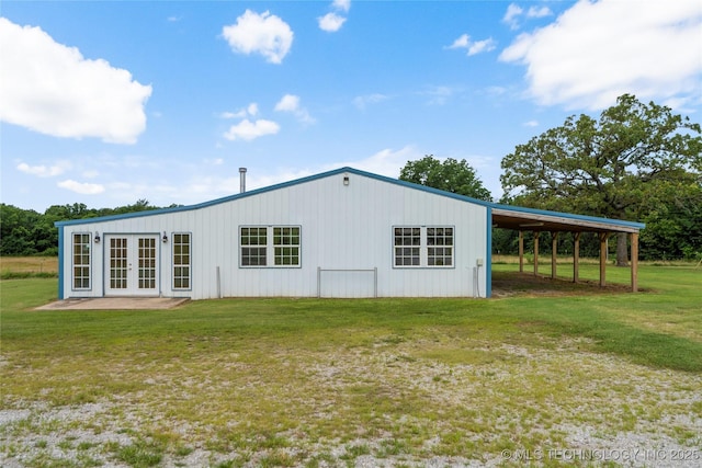 17652 S Hickory St, Sapulpa, OK 74066 - view of property exterior featuring french doors and a lawn