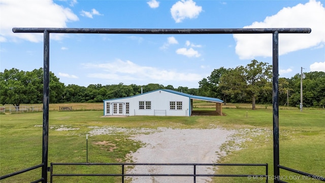 17652 S Hickory St, Sapulpa, OK 74066 - view of side of home featuring dirt driveway, a carport, an outbuilding, and a pole building